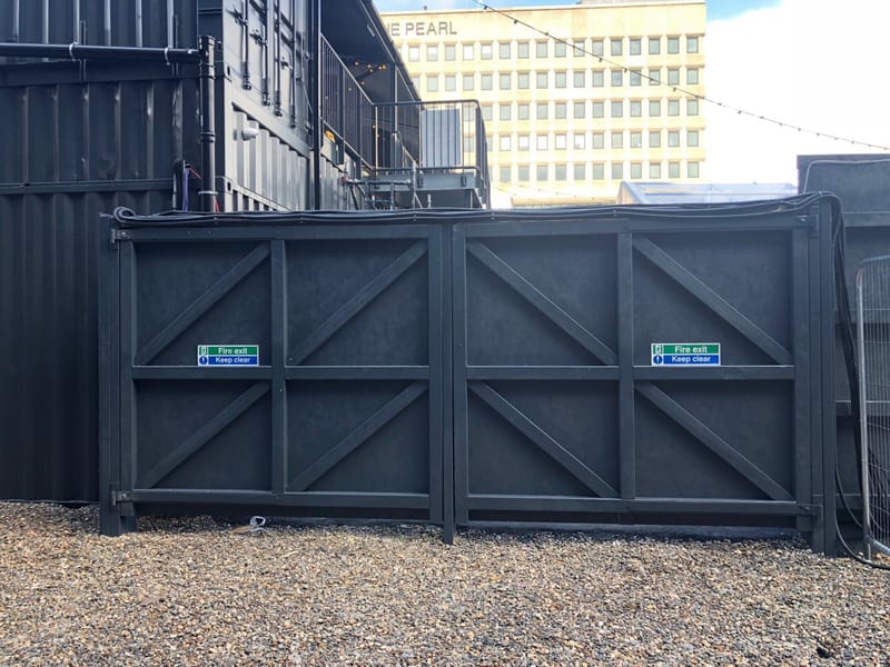 Branded site hoarding with weldmesh gates